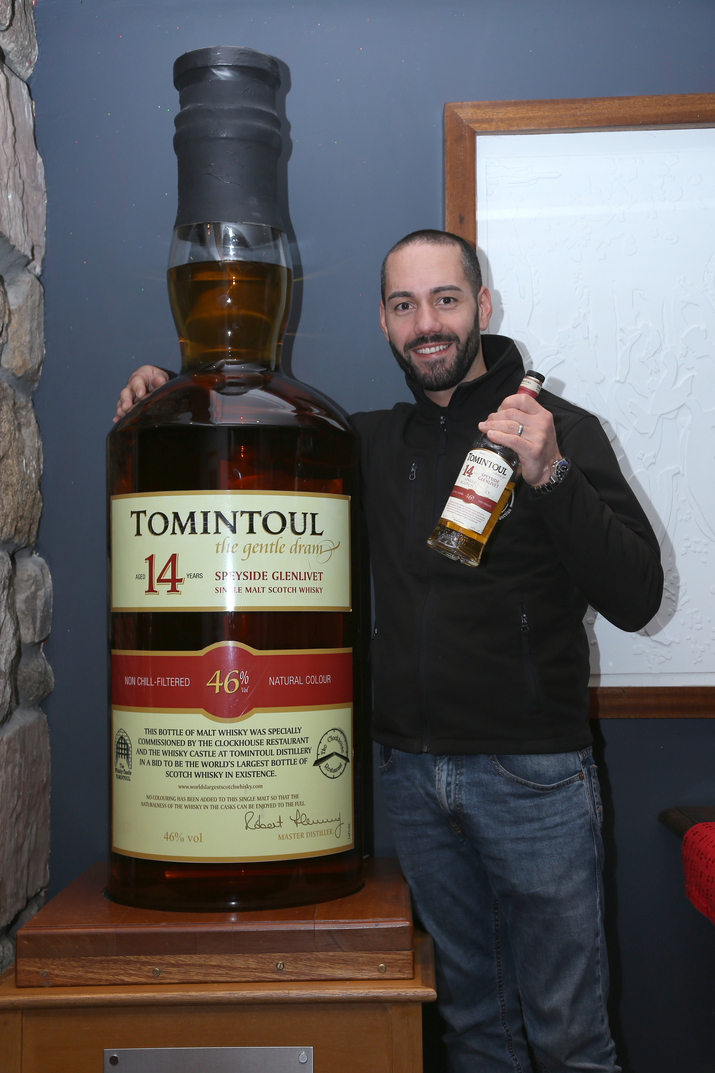 https://www.just-whisky.co.uk/190466-thickbox_default/tomintoul-14-years-old-worlds-largest-bottle-of-single-malt-whisky-1053litres.jpg